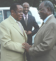 DRC Defence Minister Charles Mwando Simba shaking hands with Gen Marcel Gatsinzi during their meeting at the Rwanda-DRC border in Gisenyi. (File Photo).