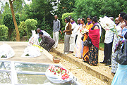 Residents of Ubwiza village lay wreaths at the mass graves in Gisozi Genocide Memorial Centre yesterday. (Photo S. Nkurunziza)