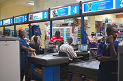 Attending to customers at Kigali Nakumatt. (Photo/G.Barya).