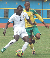 Ghanau2019s Inkoom Samuel beats off a challenge from South Africau2019s Matuka Thabang during their CAN U-20 game yesterday. Ghana won 4-3. (Photo / G. Barya).