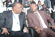 COME BACK MY FRIEND; Caf president Issa Hayatou (L) having a chat with the chairman of the local organising committee Brig. Gen John Bosco Kazura. (Photo / G. Barya).