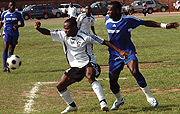 Bokungu (L) battles with Rayon defender Rucogoza. The Congolese striker scored for his side over the weekend.