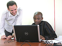 Rowan Seymour (L) instructing an EHSDI student. (Courtesy Photo).