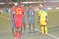 Skippers of both team (El Merreikh and Atraco) shake hands with the referees before the first leg match in Khartoum.