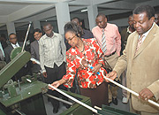 Deputy Secretary General of the Commonwealth, Masire Mwamba inspects some of the machines at KIST. (Photo J Mbanda).