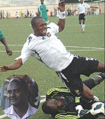 NO WAY: Gor Mahia goalie Jerry Onyango saves on the foot of APR striker Ndjoli Bokungu in yesterdayu2019s game. Inset is Omar Gafaranga a ticket collector, who has become a nightmare for sports journalists whom he denies entrance at local matches. Donu2019t show 