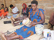 Women weaving baskets. (File photo)