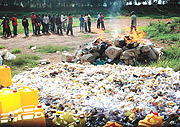 Residents of Remera witness police setting ablaze narcotics that were seized in Gasabo District during the festive season yesterday. (Photo GBarya)