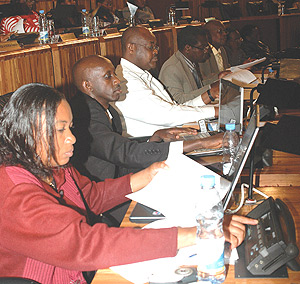 MPs Marie Claire Ingabire and Francis Kaboneka and other members of the lower chamber voting for the media law yesterday at the parliamentary building in Kimihurura. (Photo/ G.Barya).