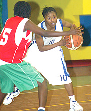 Rwandau2019s Ayebare Honoree tries to drive past Burundiu2019s Bucumi in yesterdayu2019s Fiba Africa Zone V game. Rwanda won 81-44. (Photo / G. Barya)