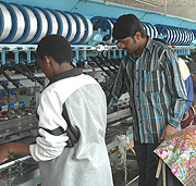 Workers on a silk production line. (Photo/ G.Barya).