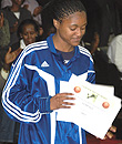 MPV: Rwandau2019s Honore Ayebare admires her certificates at the end of the  Zone V Fiba-Africa qualifiers last month.