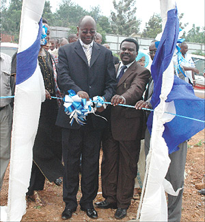 Finance Minister James Musoni cuts the ribbon to mark the launch of the sale of new plots in the Central Business District yesterday. (Photo GBarya).