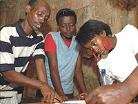 MUTIMURA Tega film Director explains the script to the cast.