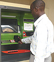 A man uses a smart card to make his transaction.