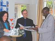 L-R: Lisa Girrbach Health Sector coordinator of GTZ, Deputy Ambassador Frank Maier and Thaddee Kibamba, of Gicumbi District during the function. (Photo/ C. Kwizera).