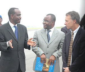 Health Minister Dr Richard Sezibera with Aurelien Agbenoncthe UN Resident Coordinator (C) and USAID Director,Dennis Weller after the arrival of the vaccines yesterday. (Photo/ G.Barya).