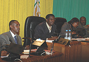 CNLG boss J.D Mucyo (L) before the parliamentary session yesterday. (Photo/ G. Barya).