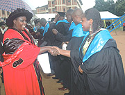 Education Minister Daphrose Gahakwa congratulates some of the Post-graduate students during the graduation ceremony at KIE yesterday. (Photo/ J Mbanda)