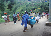 People transport goods across Rusizi boarder post. With time, border will be just a mental thing in East Africa. (File Photo).