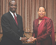 Health Minister Dr Richard Sezibera receiving the Global Health Progress award on behalf of First Lady Jeannette Kagame from Alicia D. Greenidge for outstanding Leadership in advancing access to HIV/AIDS treatment in Rwanda. (Photo/G.Barya).