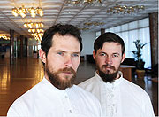 Vasily Reutov, left, and his brother-in-law, Aleksei Kilin, are resettling in Russia, lured to their ancestral homeland by a program that is helping them move. (Net Photo)