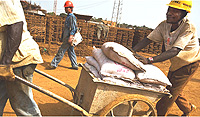 Guinean and Chinese workers at the construction site for a $50 million, 50,000-seat stadium in Conakry, the capital.