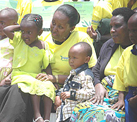 The first lady and Minister for Education listen attentively at proceedings during the ceremony to honour Guardian Angels.