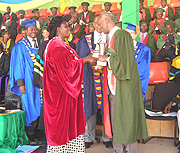 Professor Faustin Rutembesa recieves recognition from Minister Gahakwa for his distinguished service to the University. (Photo P. Ntambara).