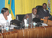 Youth and Culture Minister Joseph Habineza (R) and Rosemary Museminali  at Parliament yesterday. (Photo/ G.Barya).