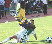 IN FORMER SHADOW: Said Abedi Makasi is sandwiched by three Algerian players during their match at Amahoro stadium. (Photo / G. Barya).