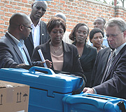 USAID Director Dennis Weller inspecting some of the equipment donated yesterday. Looking on is MINISANTE PS Agnes Binagwaho. (Photo/ G.Barya).