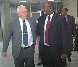 James Musoni and David MacRae after signing of the MoU at MINECOFIN yesterday. (Photo/ J. Mbanda).