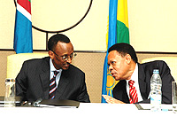 President Paul Kagame at the helm of the countryu2019s economy, shares a light moment with Juma Mwachu, EAC Secretary General during this yearu2019s EAC retreat. (File Photo).