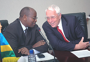 Finance Minister James Musoni talks to the Head of the EU Commission in Rwanda David MacRae at the Signing ceremony. (Photo/ J. Mbanda).
