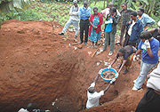 Residents of Nyamirambo witness as the remains of Genocide Victims are exhumed  at St Andreu2019 yesterday. (Photo/ J. Mbanda).