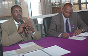 CNLG Executive Secretary Jean de Dieu Mucyo (L) lectures to CAA staff as CAA Director General Richard Masozera takes notes at the airport event on Wednesday. (Photo J Mbanda).