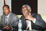 The Chairman of National Electoral Commission Chrysologue Karangwa (R) , and the Spokesperson of the Forum for Political Parties, Protais Mitali, at the presentation of the Draft Electoral Code yesterday. (Photo G Barya).