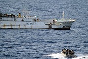 A Somali pirate mothership being stormed by NATO commandoes.