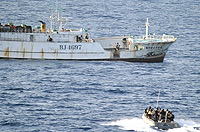 A Somali pirate mothership being stormed by NATO commandoes.