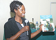 Josephine Odera Regional Director of UNIFEM Central Africa Regional Office displaying the report on GBV yesterday.