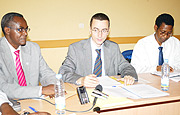 Prof. Michael Kramer the Director General of Trac Plus (centre) and Miinistry of Health officials discuss the swine flu.