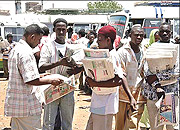 Newspaper vendors await clients, should their movement to limited.