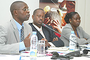 The Permanent Secretary in the Ministry of Education Mathias Harebamungu, BRDu2019s Jack Kayonga and Jane Onoka of IFC at the workshop yesterday. (Photo/ G.Barya).