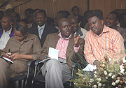 Kigali City District Mayors- Paul Jules Ndamage of Kicukiro (C) and Origene Rutayisire of Nyarugenge chat. On their left is Gasabou2019s Claudine Nyinawagaga. This was during the Kigali City Open Day. (Photo/ J. Mbanda).