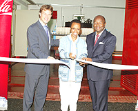 (L-R) BRALIRWAu2019s Managing Director, Sven Pieteriet; Director General (REMA), Dr Rose Mukankomeje; Coca-Cola East and Central Africa Manager Prosper Tchovambe cutting the ribbon to officiate the wastewater treatement plant on Wednesday.