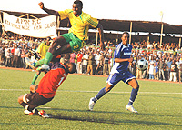 AIR BOUND: Rayon Sports goalkeeper Lawrance Webo brings down Atraco striker Peter Kagabo in the penalty box in the corresponding fixture.