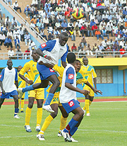 HEADS YOU WIN: Rayon Sport defender Bonaventure Hategekimana gets to the ball first ahead of Atraco striker Andre Lomami during the yesterdayu2019s league match played at Amahoro stadium, which ended 0-0. (Photo/ G. Barya)