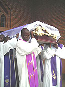 Pall-bearers leading a burial procession. File photo