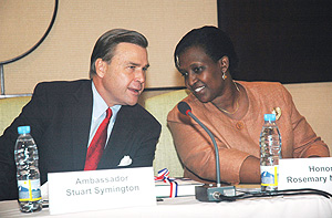 US Ambassador Stuart Symington (L) talks to  Minister Rosemary Museminali during the seminar on managing security resources in Africa at Serena Hotel. (Photo J. Mbanda).